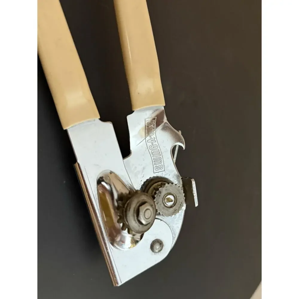 Swing Away Can Opener Ivory Rubber Grips Stainless Steel Made In USA Very Clean